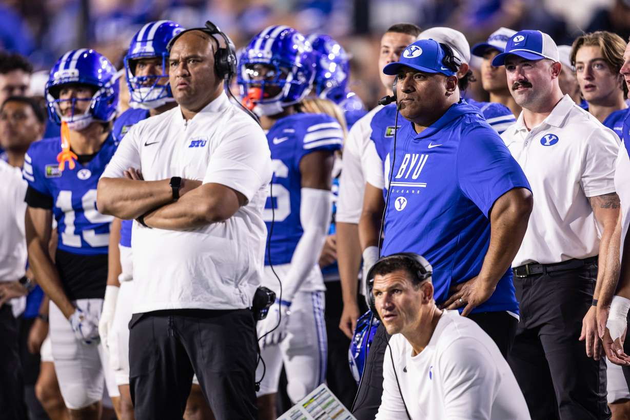 BYU Cougars head coach Kalani Sitake, right, watches his kicker kick a PAT during a game against Utah Tech at LaVell Edwards Stadium in Provo on Saturday, Sept. 5, 2026.