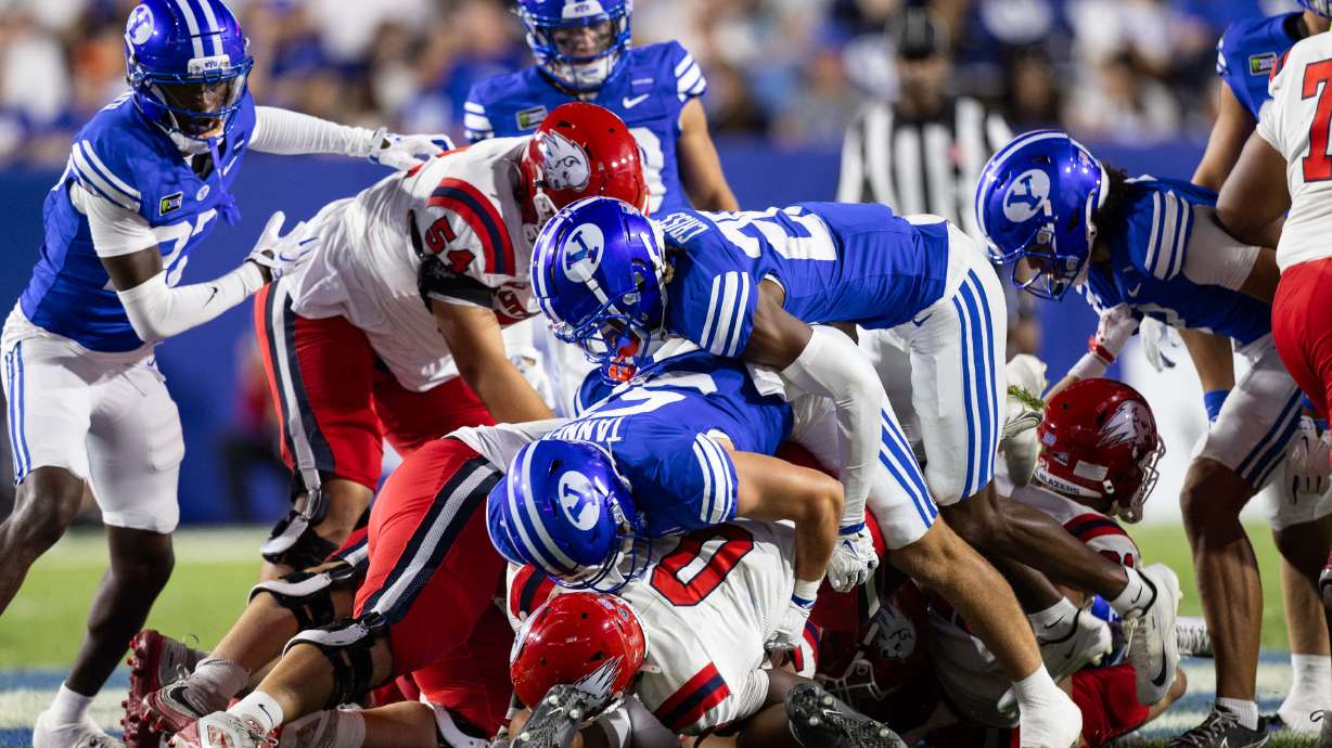 BYU defenders stuff Utah Tech Trailblazers running back Ace Chatman (0) at the line during a game against Utah Tech at LaVell Edwards Stadium in Provo on Saturday, Sept. 5, 2026.
