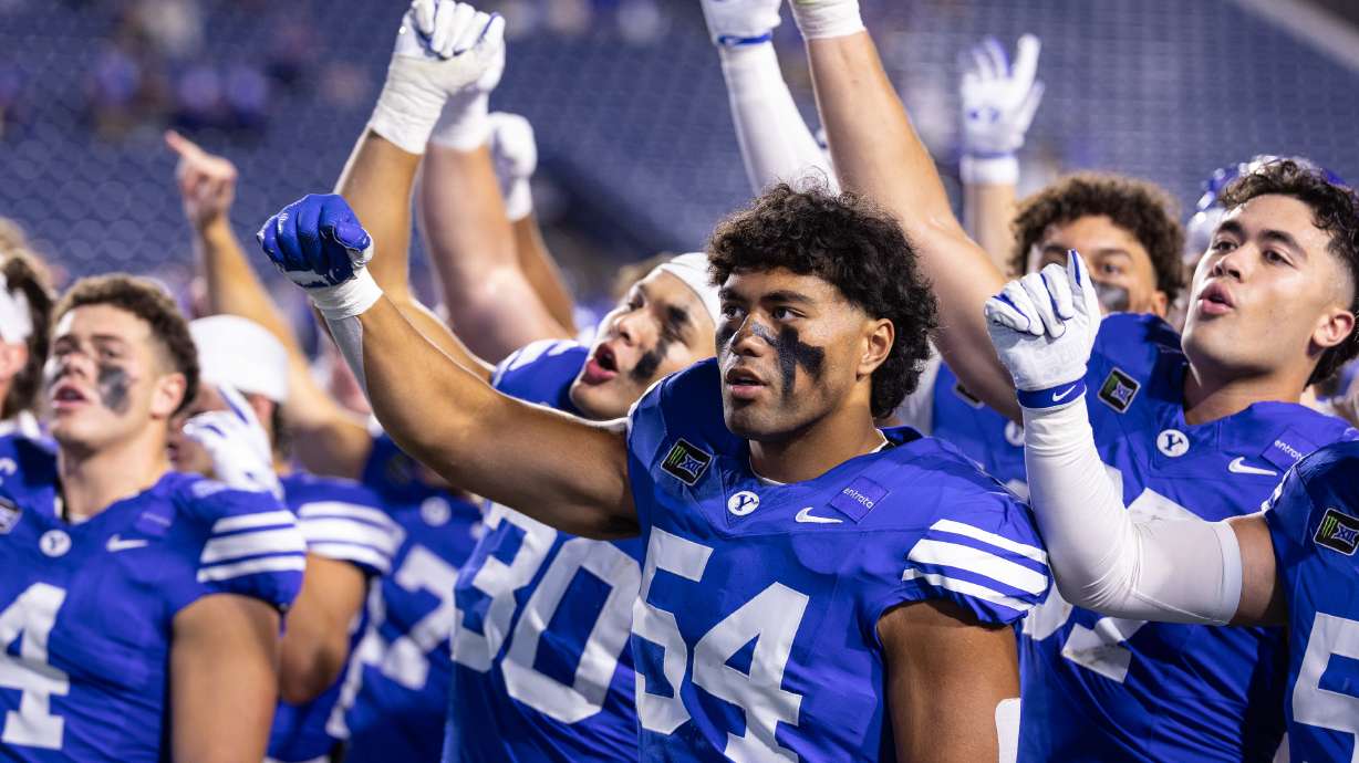 BYU players sing the fight song in front of the student section after a game against Utah Tech at LaVell Edwards Stadium in Provo on Saturday, Sept. 5, 2026.