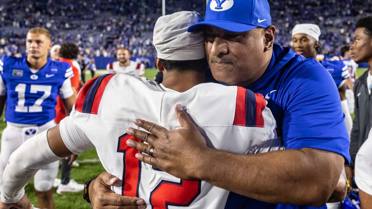 BYU Cougars head coach Kalani Sitake hugs a Utah Tech player after a game at LaVell Edwards Stadium in Provo on Saturday, Sept. 5, 2026.