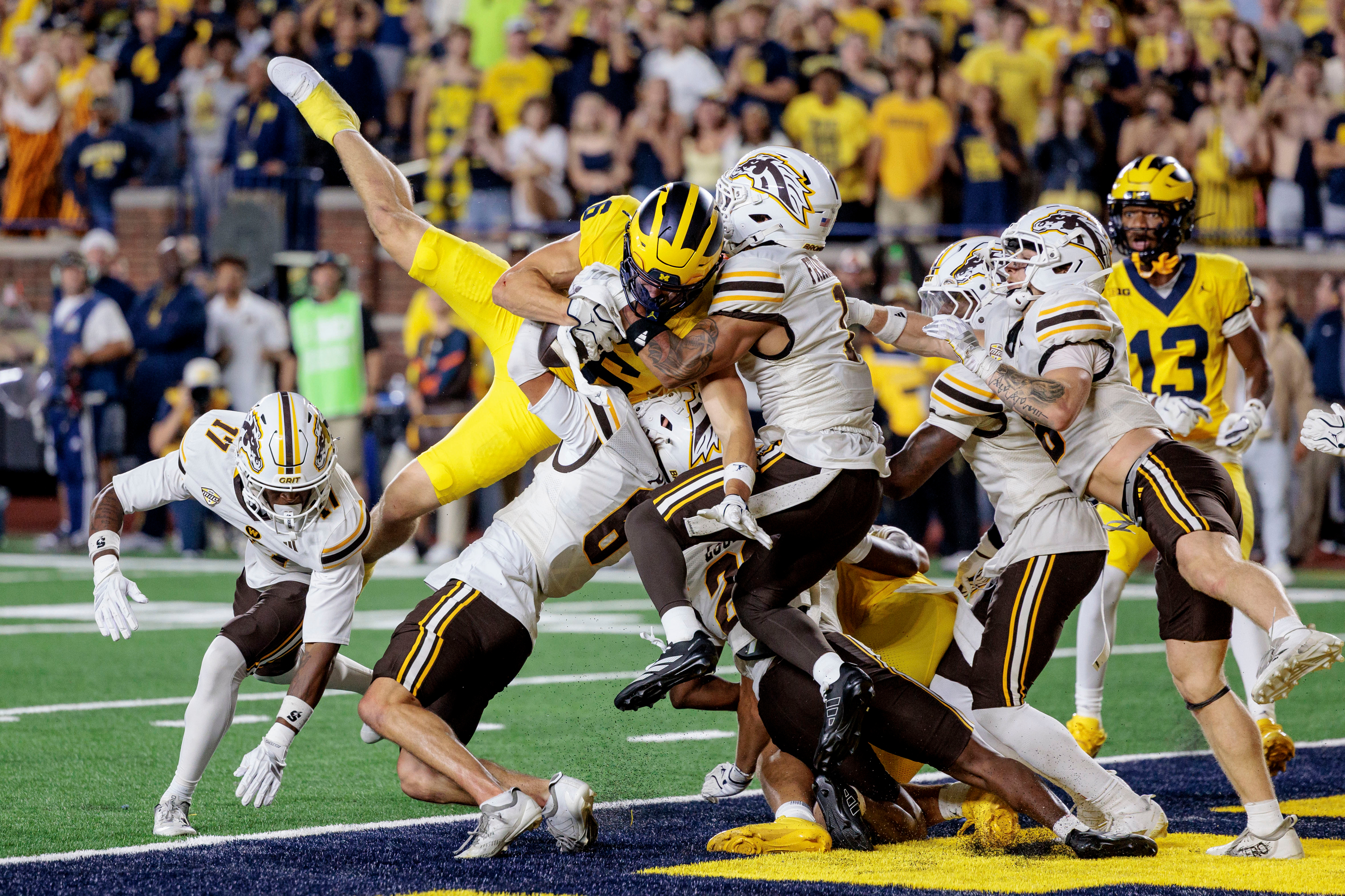 No. 16 Michigan escapes an 'epic loss' thanks to a disputed replay and a second-chance Hail Mary
