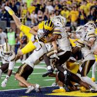 Saturday Night Five: LSU's pause with pros, Boise State stands tall, Michigan's miracle and wipeouts galore