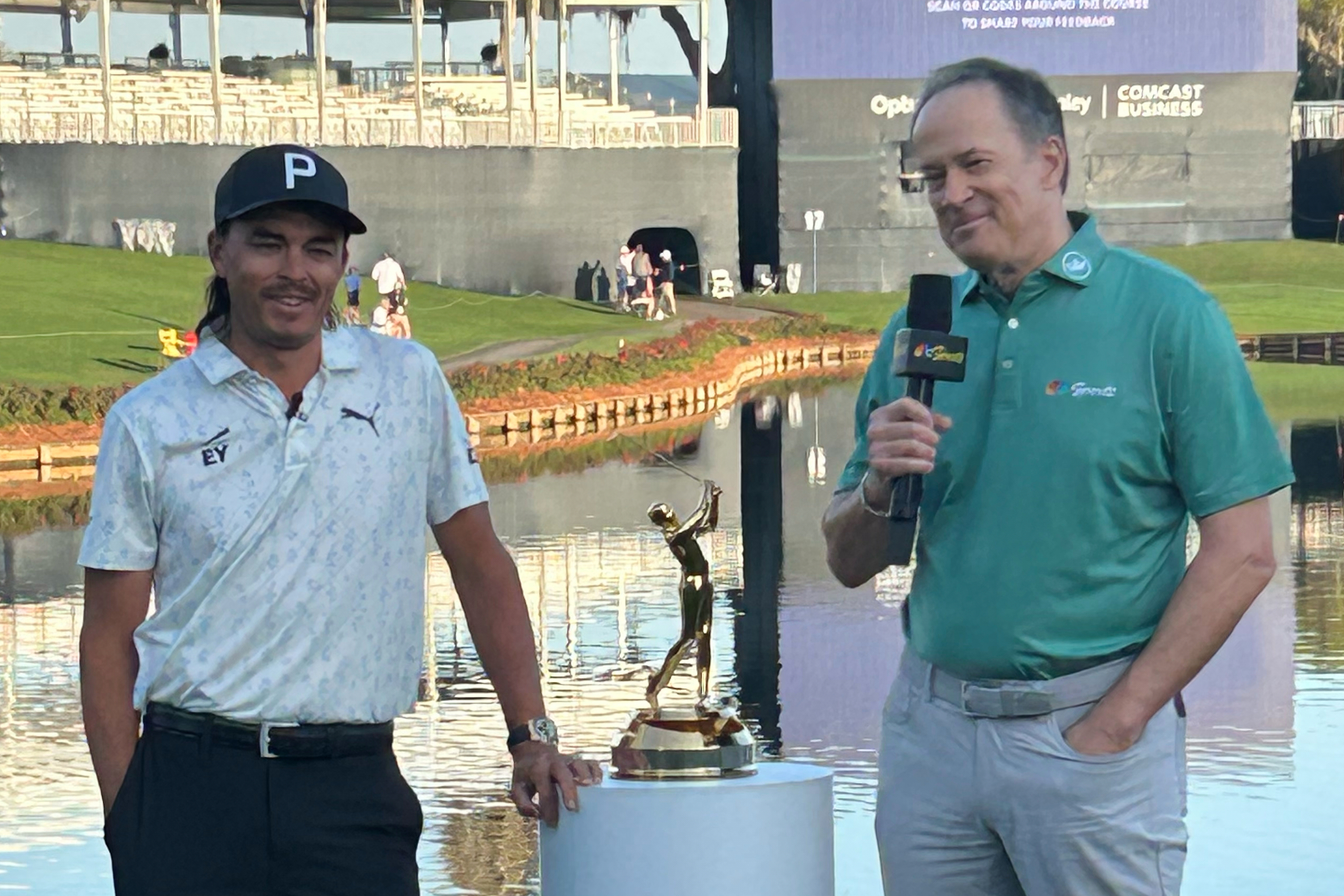 This photo provided by NBC Sports shows NBC Sports announcer Dan Hicks, right, interviewing Rickie Fowler during The Players Championship golf tournament at TPC Sawgrass in Ponte Vedra Beach, Fla., March 2026. 