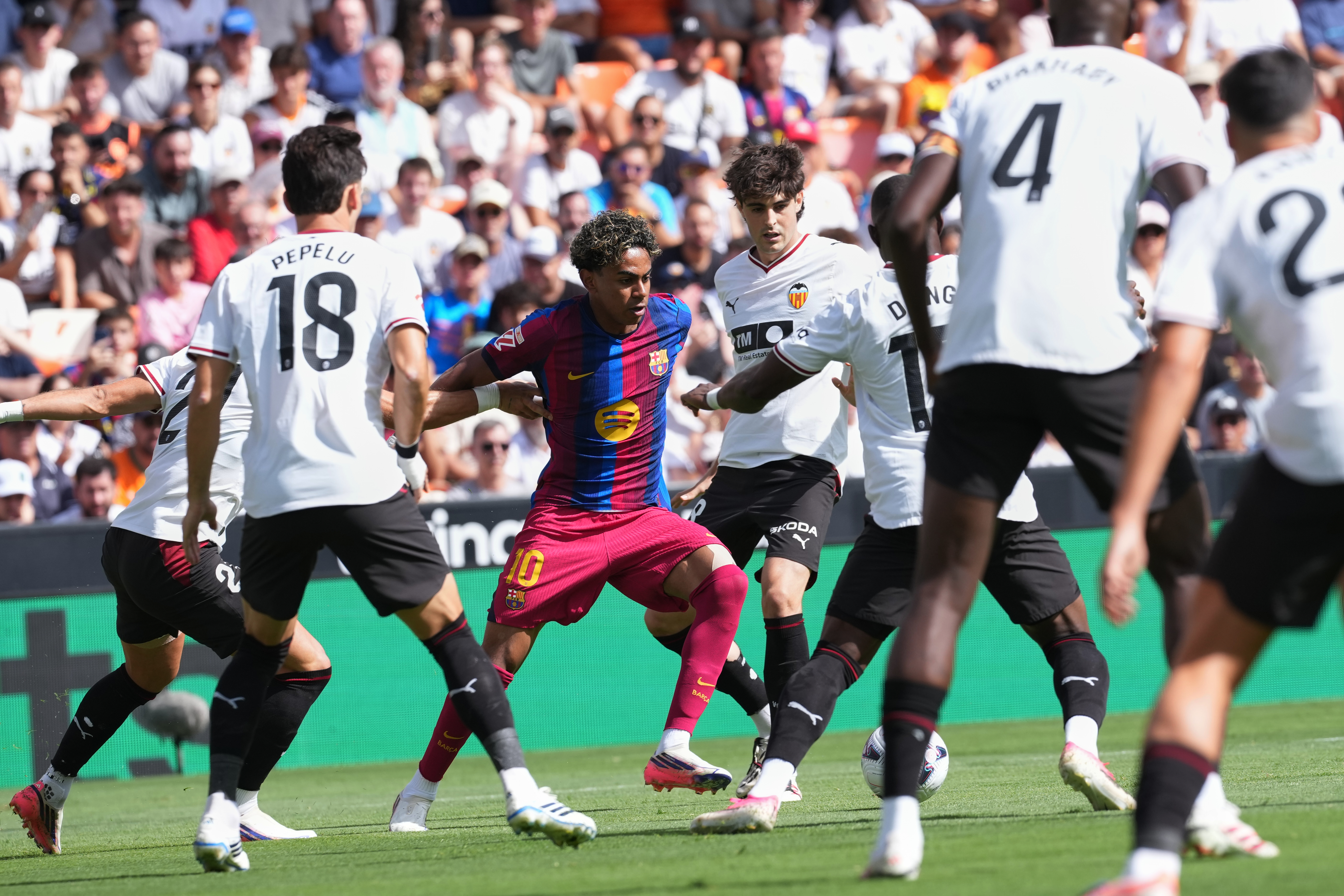 Barcelona's Lamine Yamal fights for the ball during a Spanish La Liga soccer match between Valencia and Barcelona in Valencia, Spain, Sunday, Sept. 6, 2026. 