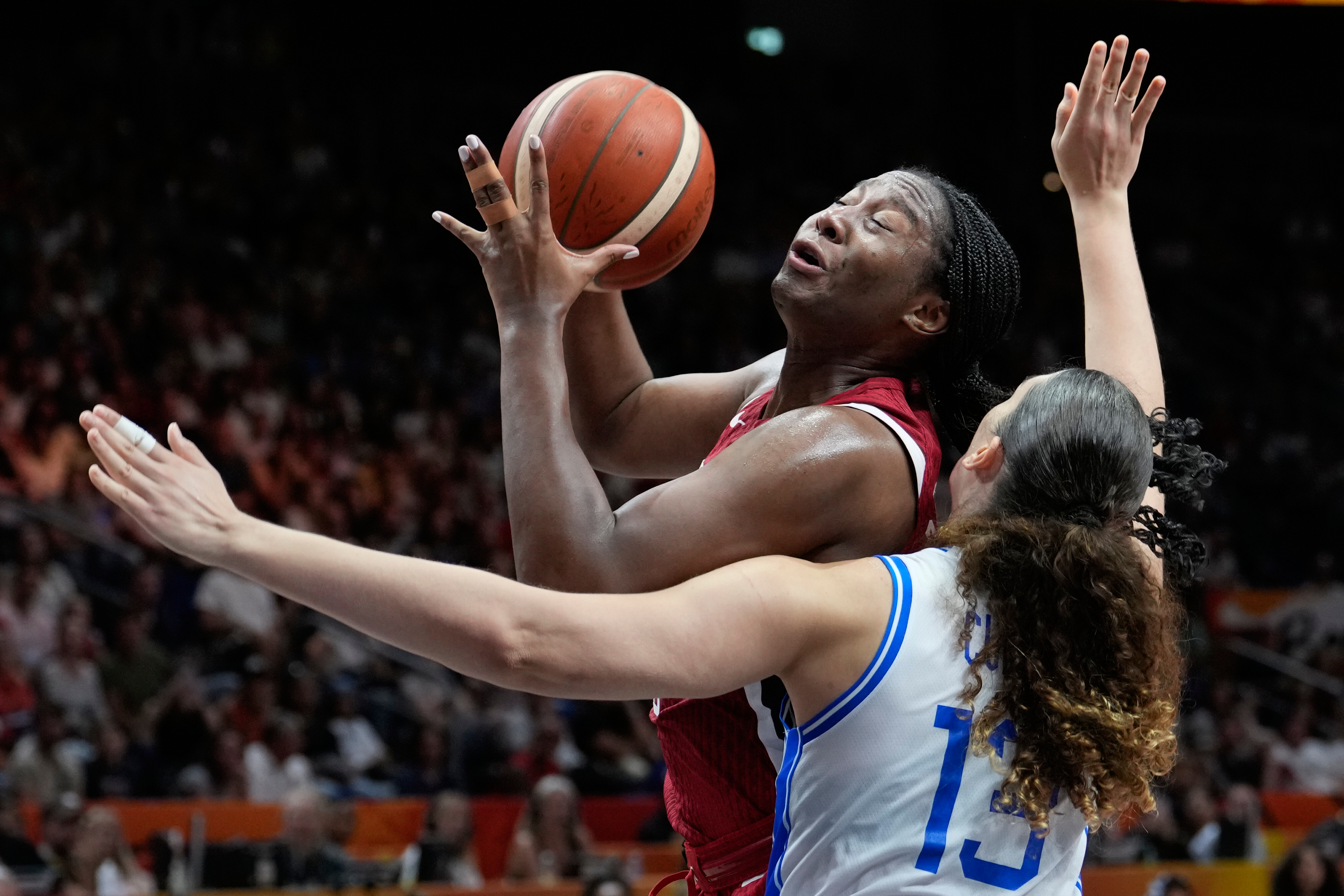 Aliyah Boston, of the United States, shoots over Italy's Lorela Cubaj during the Women's Basketball World Cup match between the United States and Italy in Berlin, Sunday, Sept. 6, 2026. 