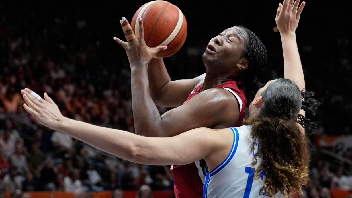 Aliyah Boston, of the United States, shoots over Italy's Lorela Cubaj during the Women's Basketball World Cup match between the United States and Italy in Berlin, Sunday, Sept. 6, 2026.