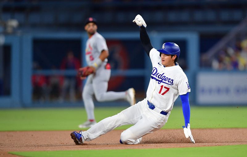 Sep 2, 2026; Los Angeles, California, USA;  Los Angeles Dodgers pitcher Shohei Ohtani (17) steals second during the second inning against the St. Louis Cardinals at Dodger Stadium.