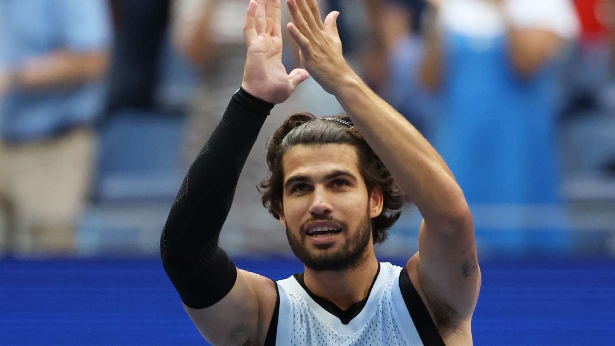 Carlos Alcaraz, of Spain, gestures after he won his match against Tommy Paul, of the United States, during the fourth round of the U.S. Open tennis championships Sunday, Sept. 6, 2026, in New York.