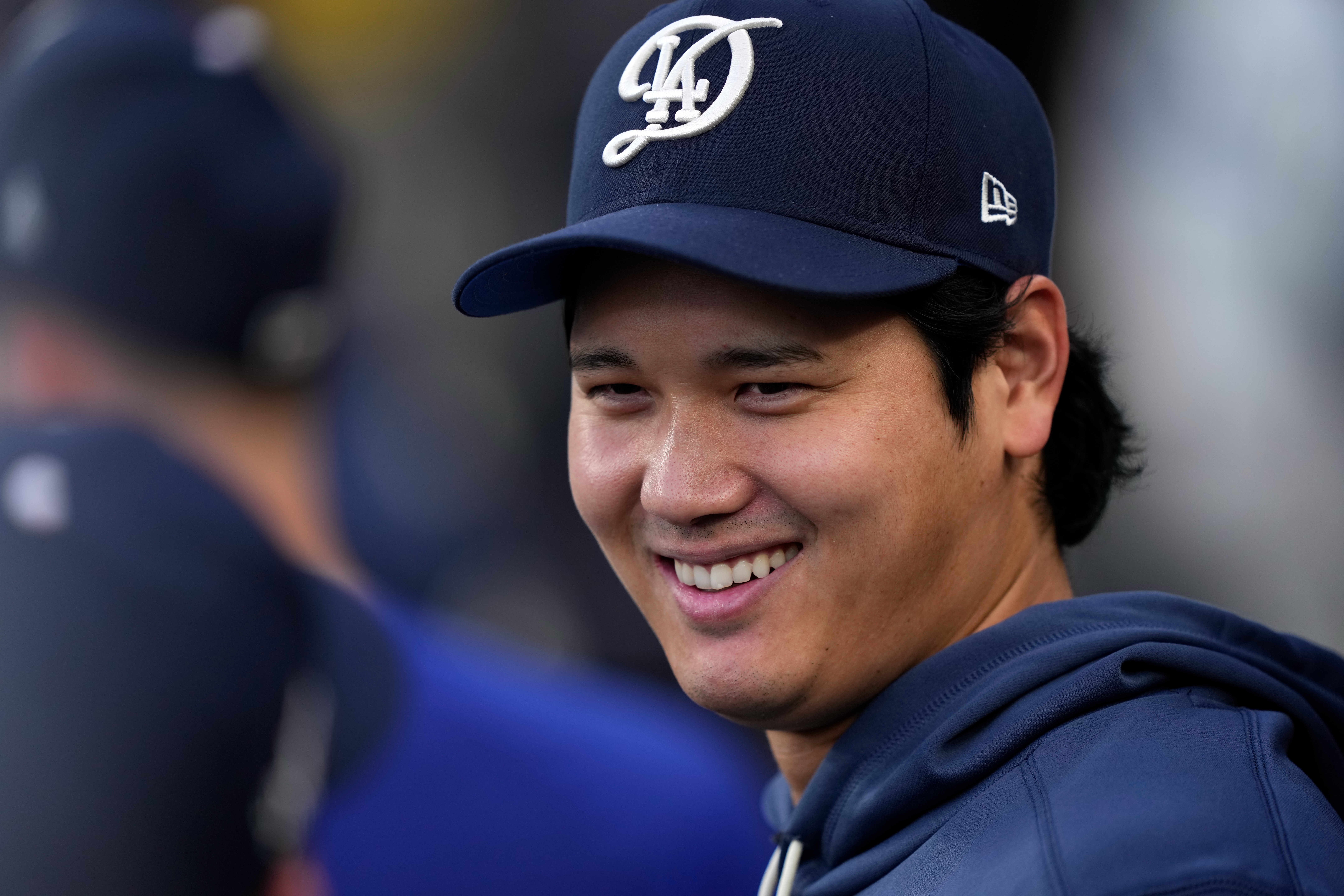 Los Angeles Dodgers' Shohei Ohtani smiles in the dugout during the first inning of a baseball game against the Washington Nationals, Saturday, Sept. 5, 2026, in Los Angeles. 