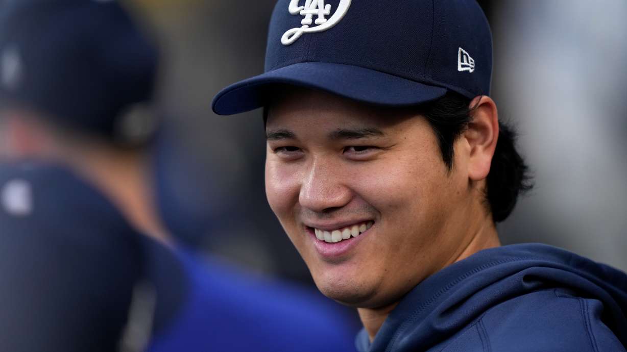 Los Angeles Dodgers' Shohei Ohtani smiles in the dugout during the first inning of a baseball game against the Washington Nationals, Saturday, Sept. 5, 2026, in Los Angeles.