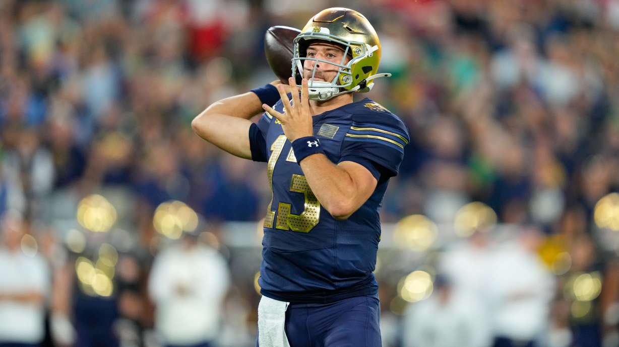 Notre Dame quarterback CJ Carr throws during the first half of an NCAA college football game against Wisconsin Sunday, Sept. 6, 2026, in Green Bay, Wis.