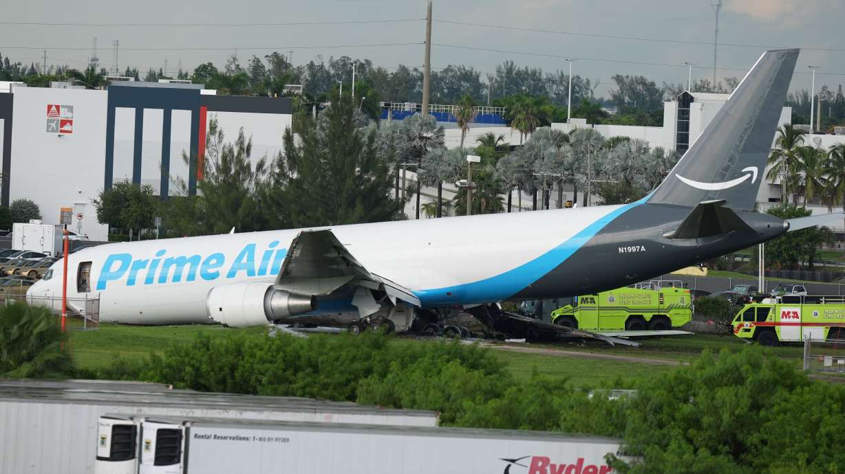 An Amazon cargo plane sits at the Miami International Airport (MIA) after it overshot the runway, Sunday.