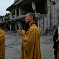 Nepal holds a day of mourning after floods kill at least 1,300 people