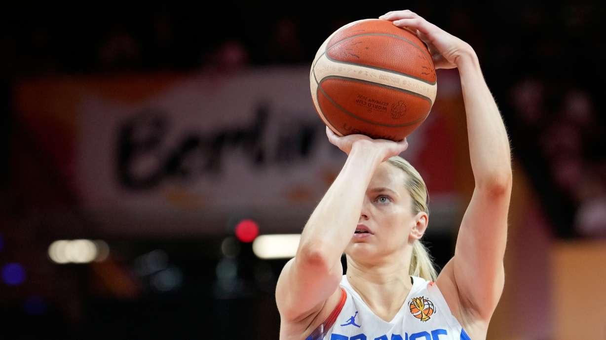 France's Marine Johannes shoots during the Women's Basketball World Cup match between France and Korea in Berlin, Saturday, Sept. 5, 2026.