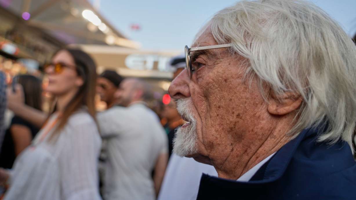 FILE - Former Formula One chief Bernie Ecclestone stands on the starting grid before the Abu Dhabi Formula One Grand Prix in Abu Dhabi, United Arab Emirates, Dec. 7, 2025.