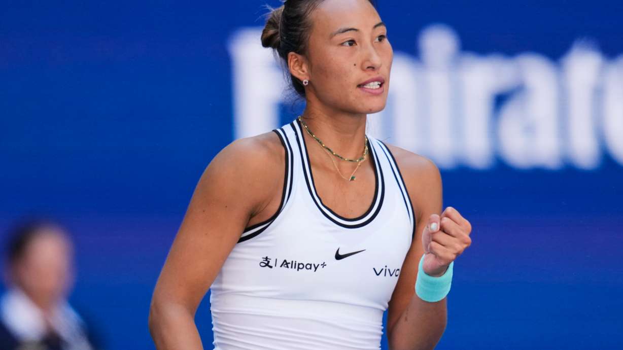 Qinwen Zheng, of China, reacts during a match against Iga Swiatek, of Poland, during the fourth round of the U.S. Open tennis championships, Monday, Sept. 7, 2026, in New York.