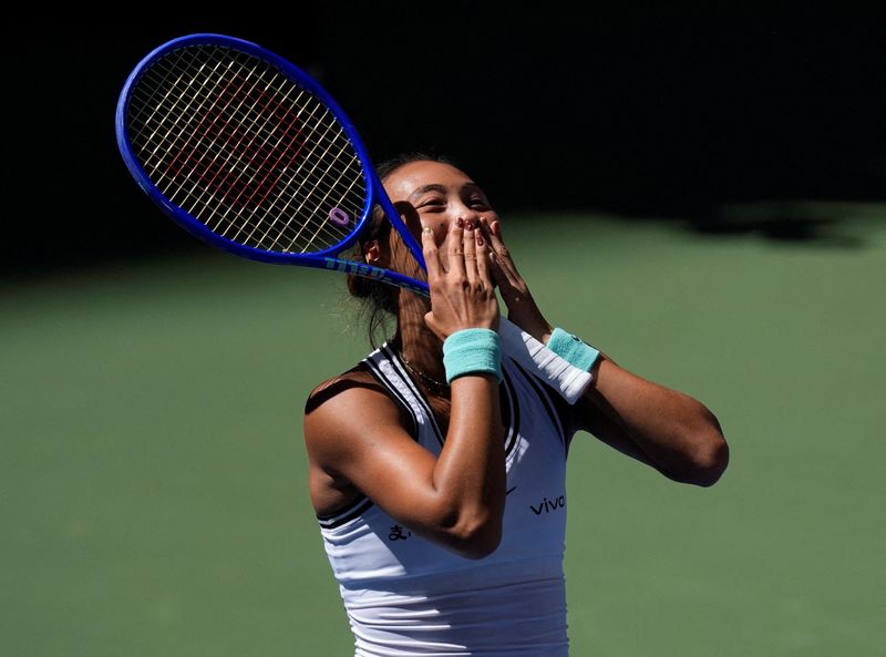Tennis - U.S. Open - Flushing Meadows, New York, United States - September 7, 2026 China's Qinwen Zheng celebrates after winning her round of 16 match against Poland's Iga Swiatek