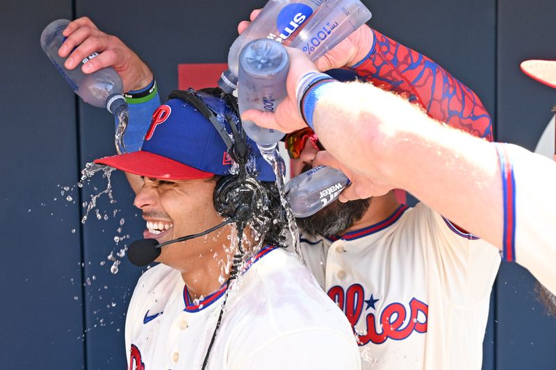 Sep 7, 2026; Philadelphia, Pennsylvania, USA; Philadelphia Phillies pitcher Jesús Luzardo (44) is doused with water by designated hitter Kyle Schwarber (12) and left fielder Brandon Marsh (16) after his complete game two-hit shutout against the Atlanta Braves at Citizens Bank Park.