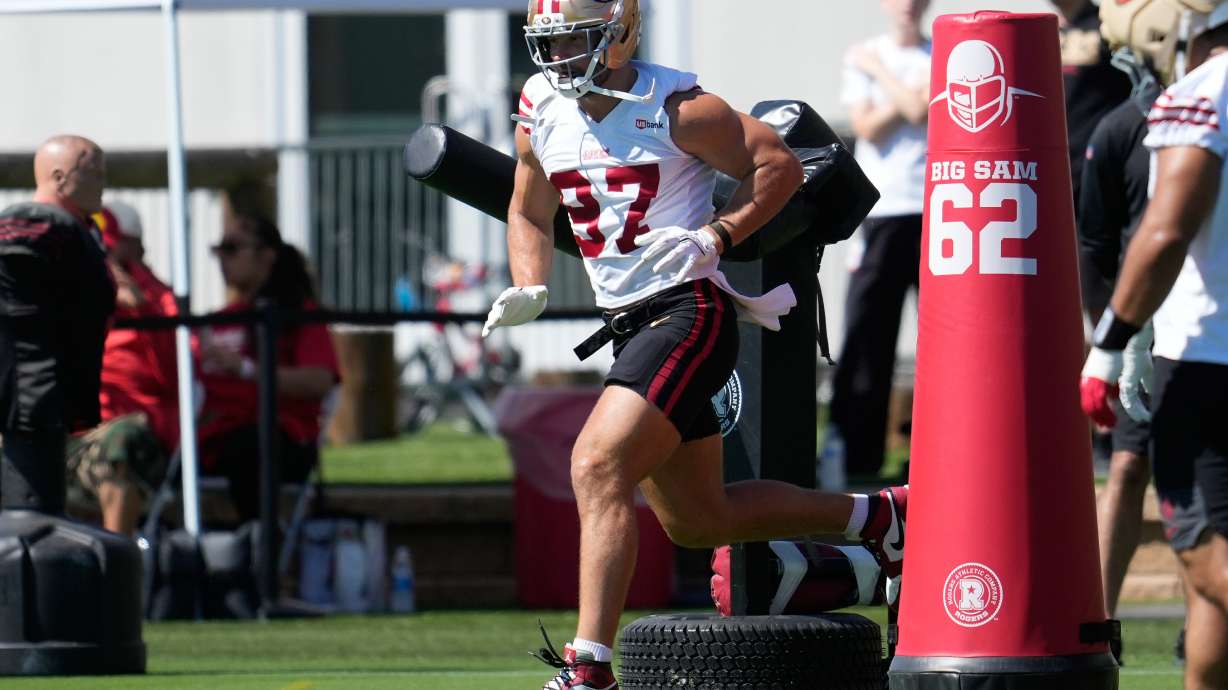 FILE - San Francisco 49ers defensive end Nick Bosa (97) runs a drill during the NFL football team's training camp, on July 27, 2026, in Santa Clara, Calif.