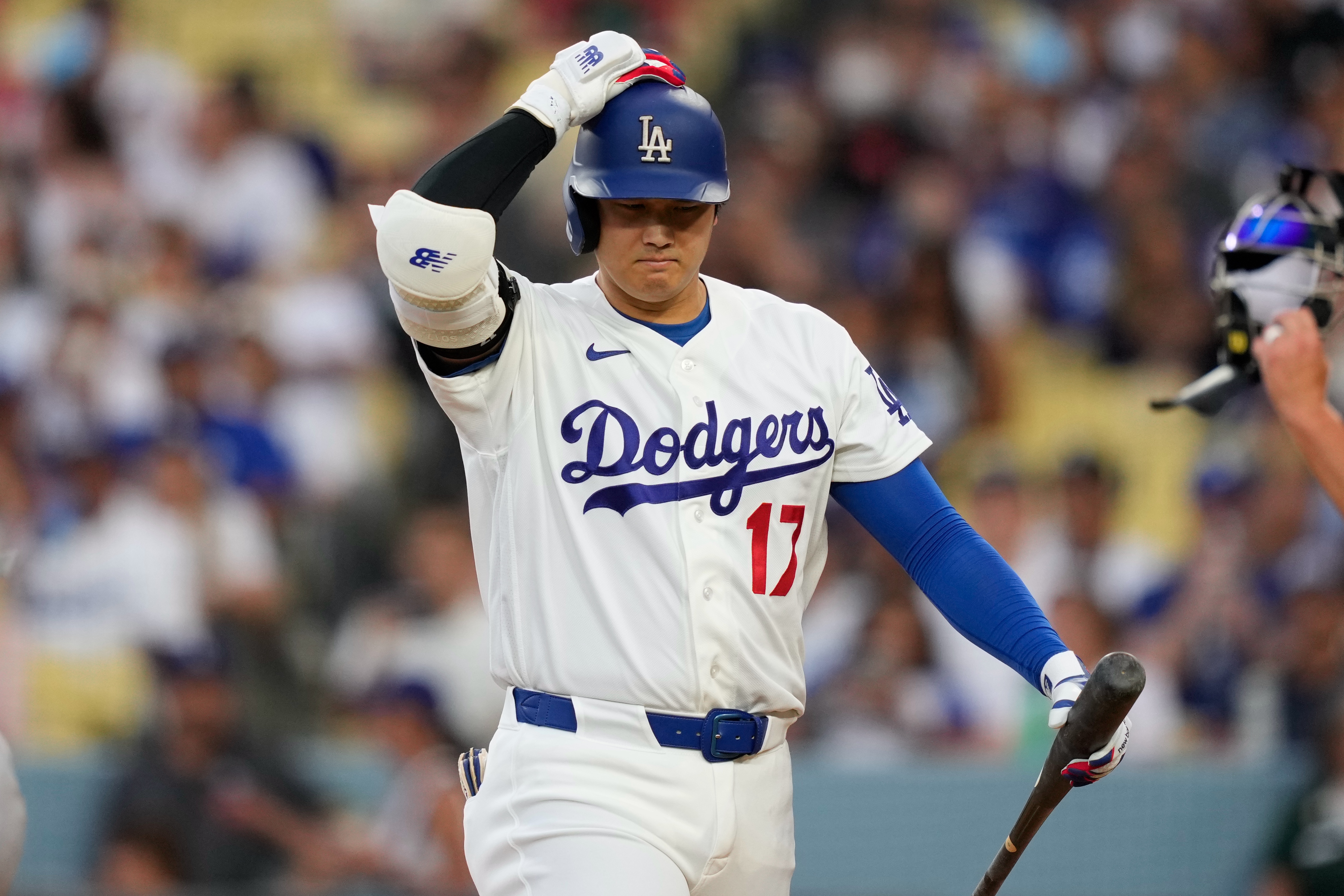 Los Angeles Dodgers' Shohei Ohtani walks back to the dugout after striking out as during the third inning of a baseball game against the Cincinnati Reds, Monday, Sept. 7, 2026, in Los Angeles. 