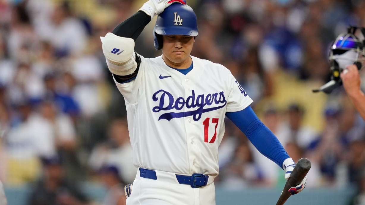 Los Angeles Dodgers' Shohei Ohtani walks back to the dugout after striking out as during the third inning of a baseball game against the Cincinnati Reds, Monday, Sept. 7, 2026, in Los Angeles.