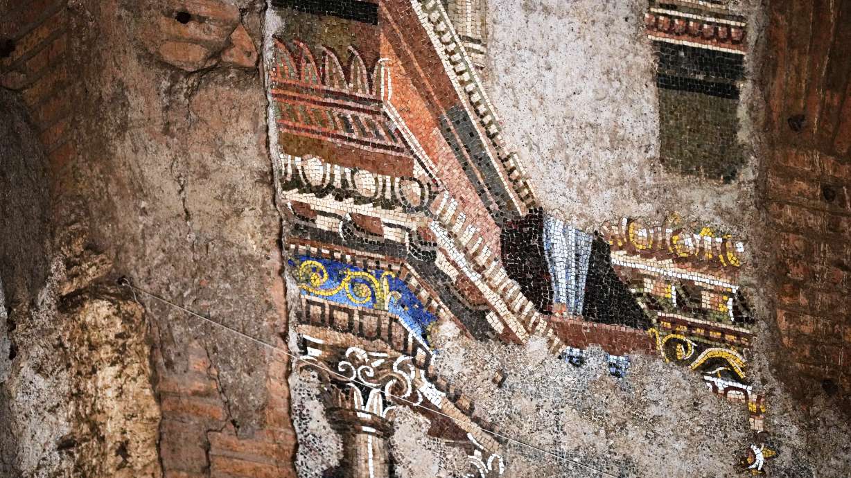 A section of the restored 15-meter ancient wall mosaic from "The Painted City" site, discovered in the late 1990s within the underground structures that served as foundations for the Baths of Trajan, is seen in Rome on Tuesday.
