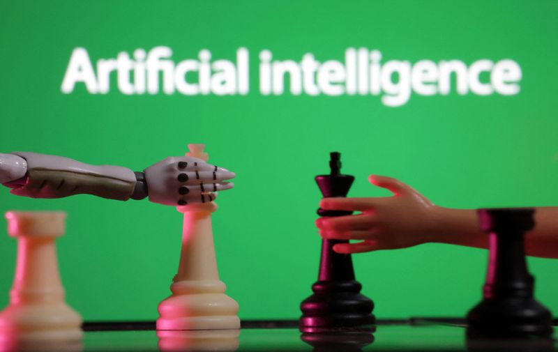 FILE PHOTO: Words reading "Artificial intelligence", miniature of robot and toy hand are pictured in this illustration taken December 14, 2023.