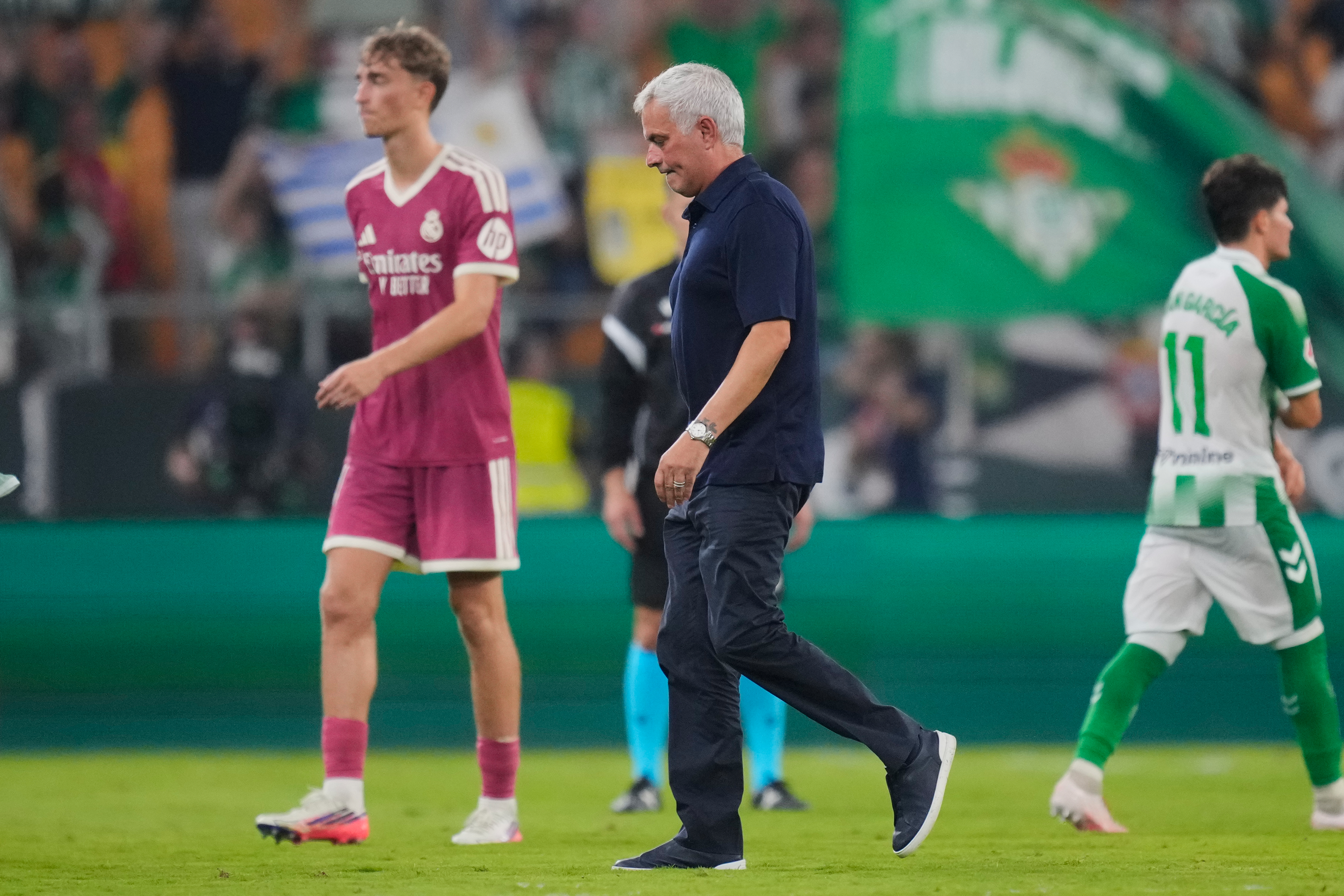 Real Madrid's head coach Jose Mourinho leaves the pitch after the Spanish La Liga soccer match between Real Betis and Real Madrid in Seville, Spain, Friday, Sept. 4, 2026. 