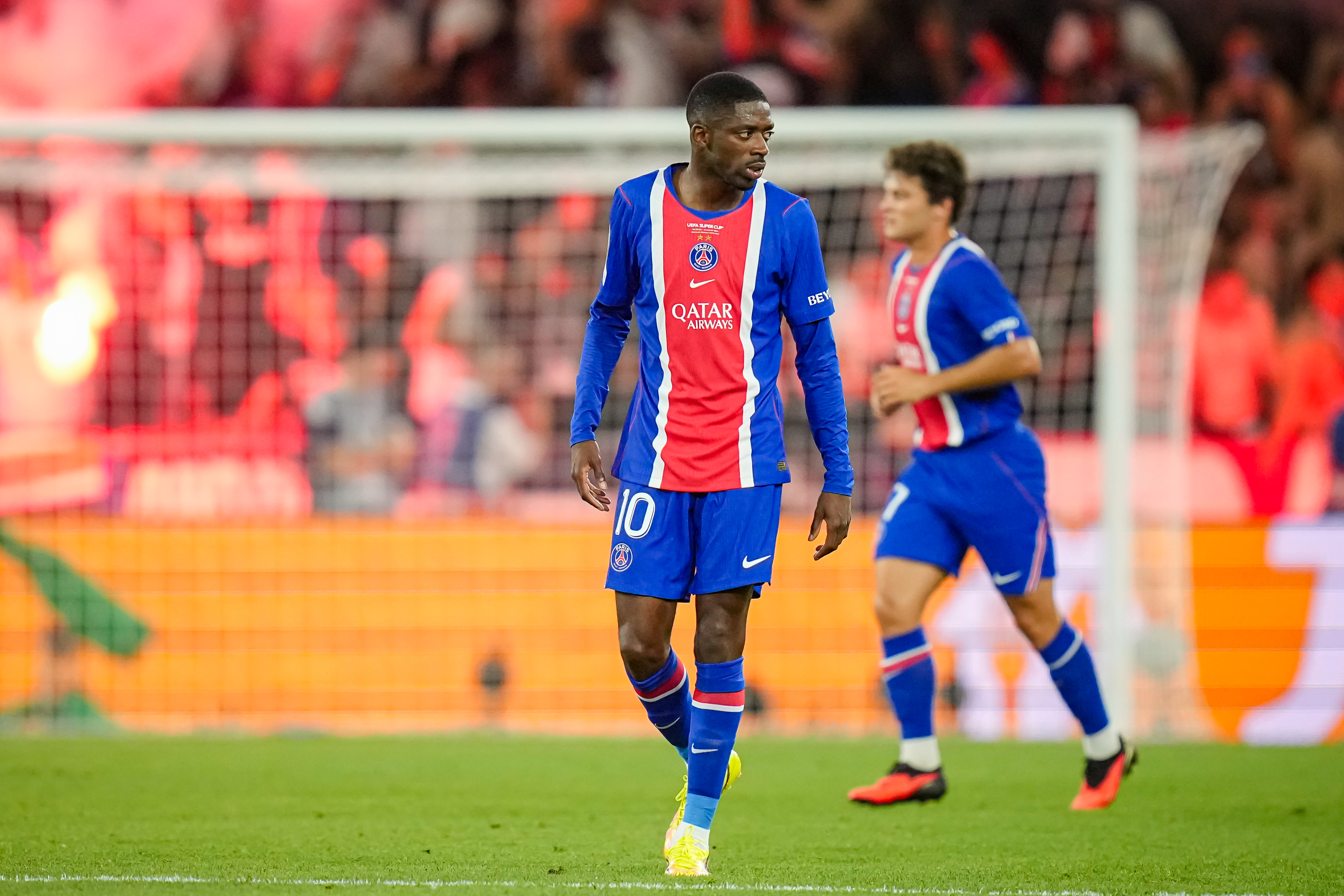 PSG's Ousmane Dembele reacts after PSG's Desire Doue scored his side's second goal during the UEFA Super Cup soccer match between Paris Saint-Germain and Aston Villa in Salzburg, Austria, Wednesday, Aug.12, 2026. 