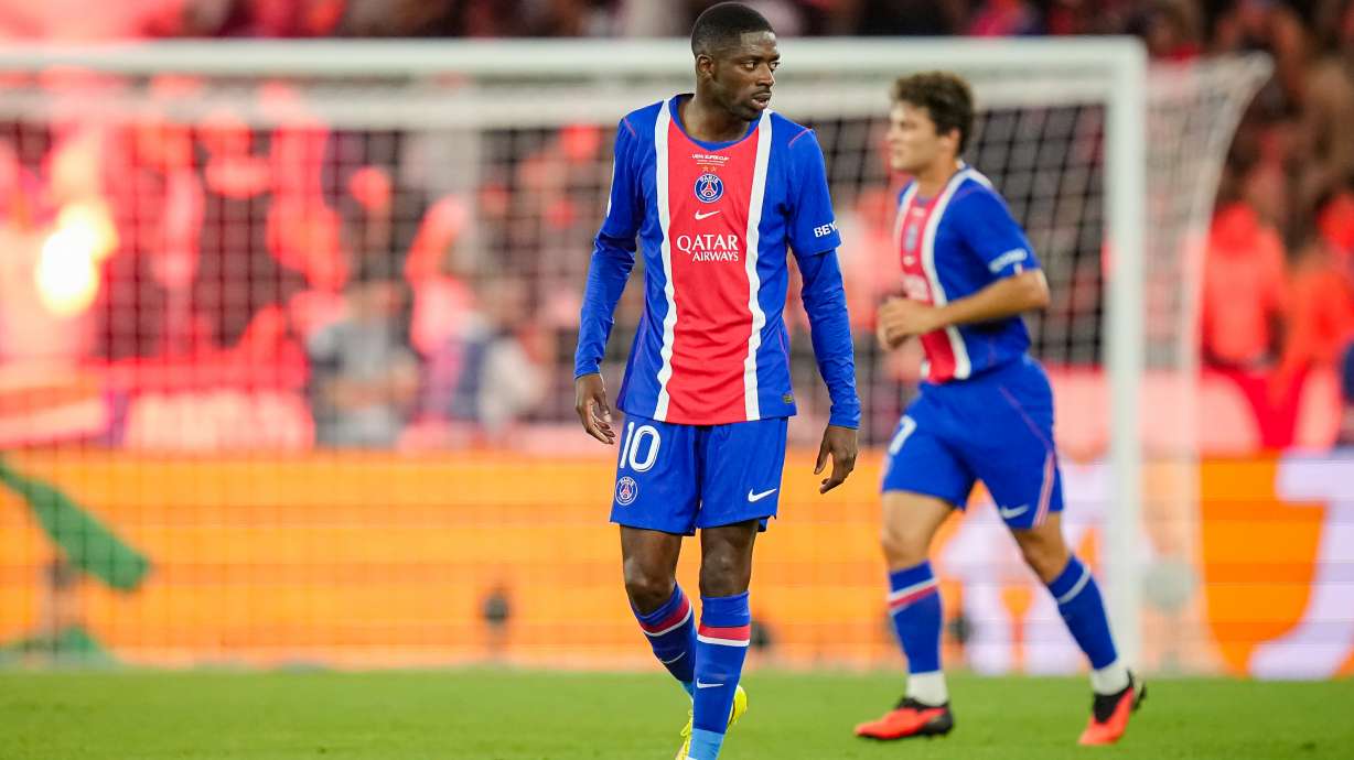 PSG's Ousmane Dembele reacts after PSG's Desire Doue scored his side's second goal during the UEFA Super Cup soccer match between Paris Saint-Germain and Aston Villa in Salzburg, Austria, Wednesday, Aug.12, 2026.
