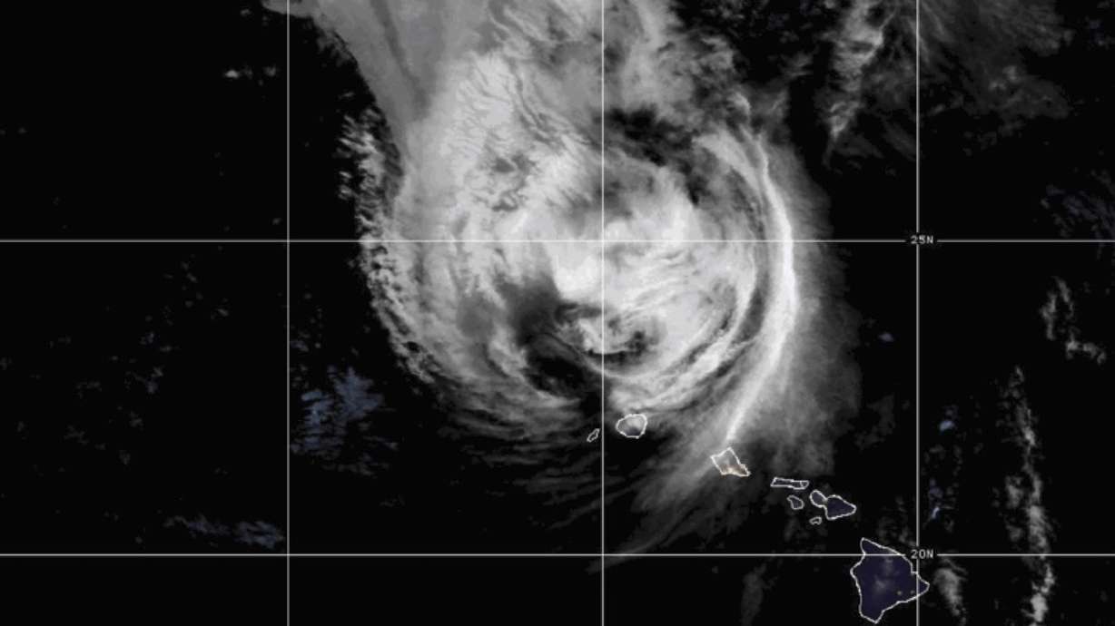 This satellite image provided by NOAA shows Hurricane Lowell near Hawaii on Tuesday. Damaging winds and heavy rains from Hurricane Lowell pelted Hawaii's western islands Tuesday, knocking out power and bringing the threat of flash floods and mudslides.
