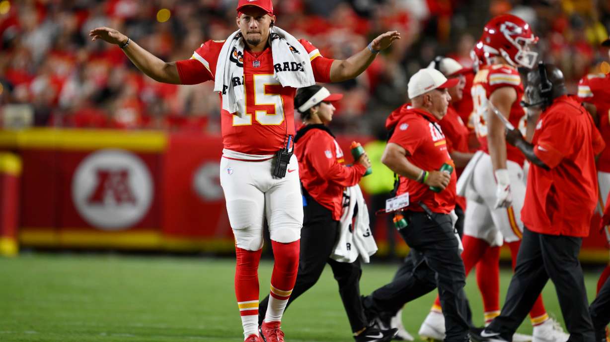 Kansas City Chiefs quarterback Patrick Mahomes (15) motions to teammates during the second half of a preseason NFL football game against the Seattle Seahawks, Friday, Aug. 28, 2026, in Kansas City, Mo.