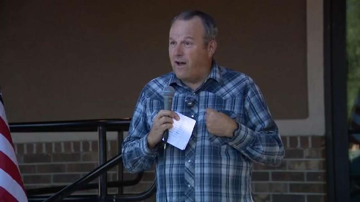 Taylor Flake speaks to a crowd protesting against the approval process for a proposed $10 billion data center in Mona, Juab County, on Tuesday.