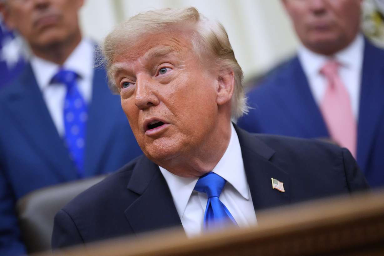 President Donald Trump speaks to reporters in the Oval Office of the White House during a meeting with travel executives, Wednesday, in Washington. Trump held what the Kremlin called a "quite frank" phone call with Russian President Vladimir Putin on Tuesday.