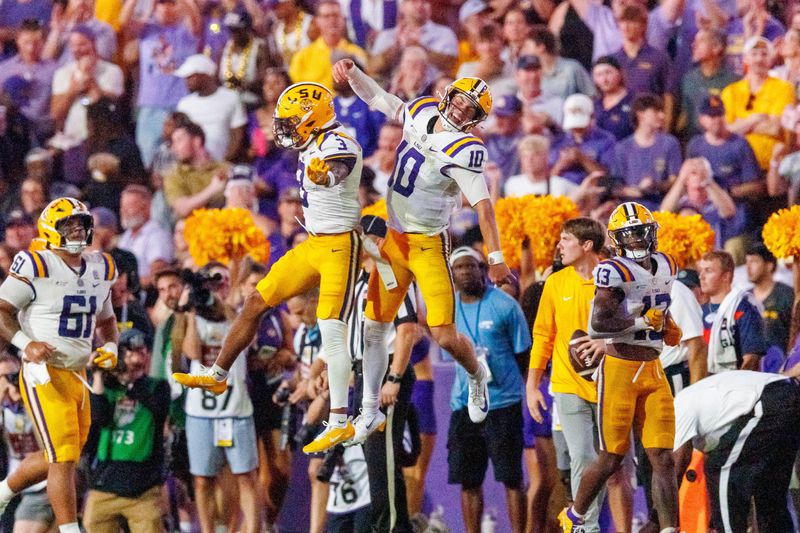 Sep 5, 2026; Baton Rouge, Louisiana, USA;  LSU Tigers quarterback Sam Leavitt (10) celebrates scoring touchdown against Clemson Tigers during the first half at Tiger Stadium.