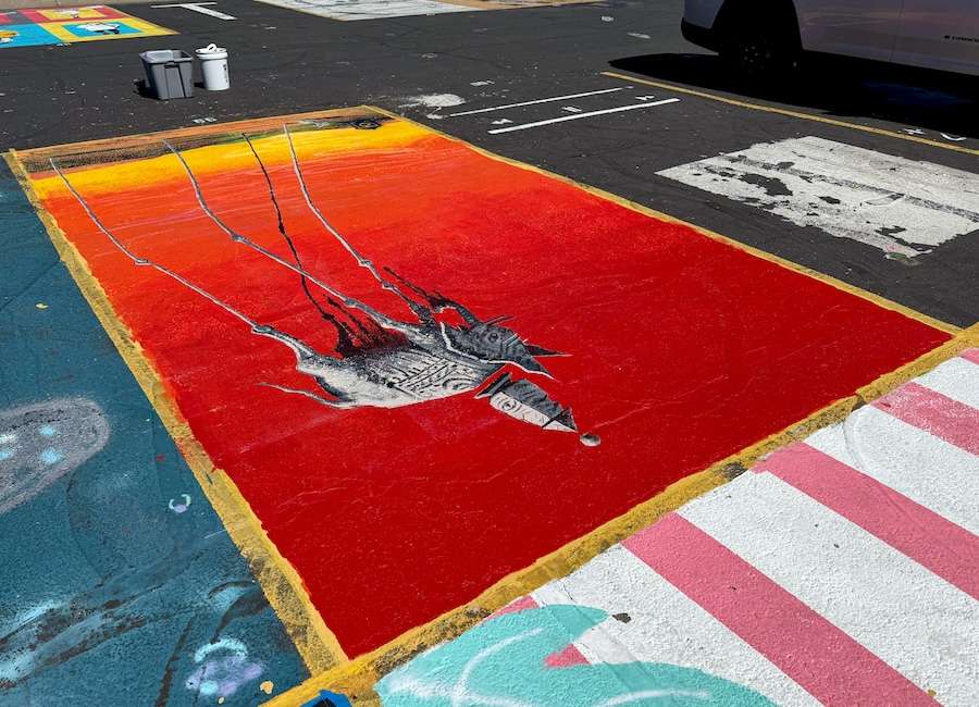 Parking lot art done by an Idaho Falls high school senior on display on Monday.