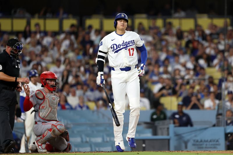 Sep 7, 2026; Los Angeles, California, USA;  Los Angeles Dodgers designated hitter Shohei Ohtani (17) reacts after fouling a ball off his foot during the seventh inning against the Cincinnati Reds at Dodger Stadium.