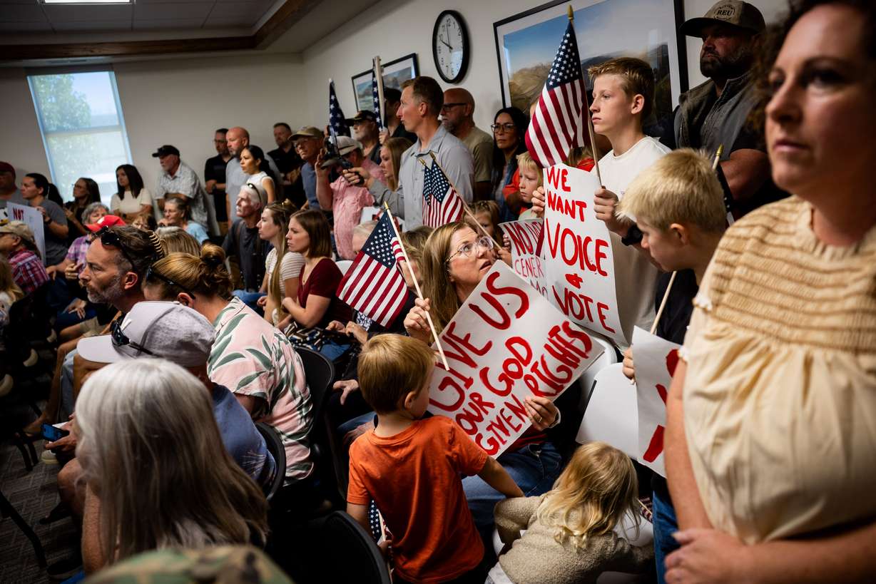 People arrive to protest the proposed data center just outside of Mona during the public comment portion of the Juab County Commission meeting at Rocky Ridge Town Hall in Rocky Ridge on Tuesday.