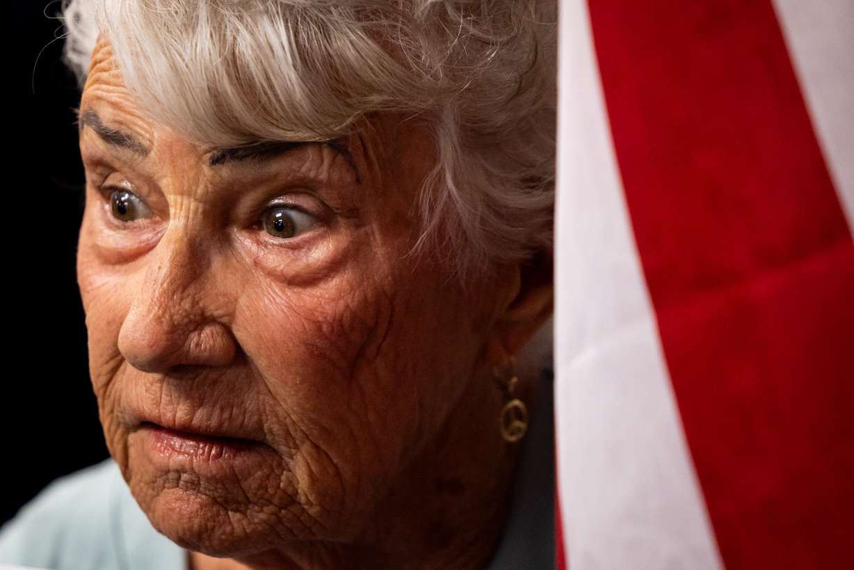 Celia Newell, center, from Mona, raises her eyebrows as commission Chairman Clinton Painter speaks about the proposed data center just outside of Mona during the public comment portion of the Juab County Commission meeting at Rocky Ridge Town Hall in Rocky Ridge on Tuesday.