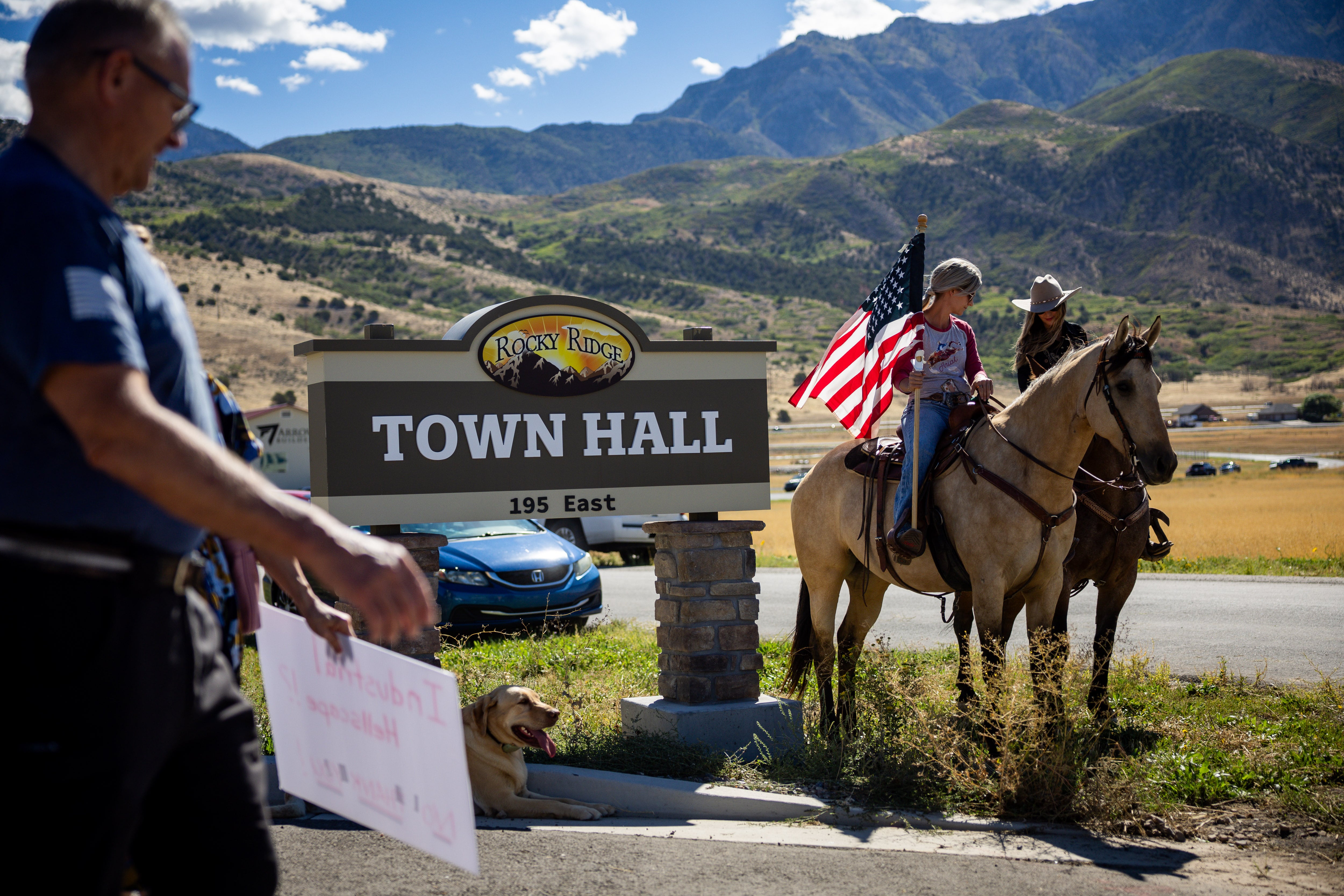 Kylie Weilacher, from Santaquin, left, and Stacie Spencer, right, from Rocky Ridge, sit on their horses after protesting the proposed data center just outside of Mona during the public comment portion of the Juab County Commission meeting at Rocky Ridge Town Hall in Rocky Ridge on Tuesday.