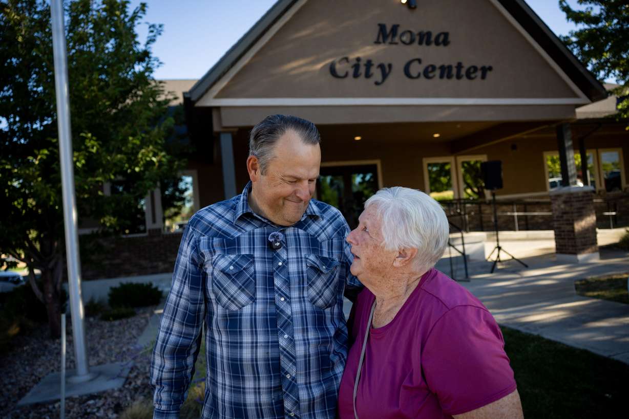 Taylor Flake, left, embraces fellow Mona resident Julie Borgeson, right, as they gather outside the Mona City Center before leaving to protest the proposed data center just outside of Mona during the public comment portion of the Juab County Commission meeting at Rocky Ridge Town Hall in Rocky Ridge on Tuesday.