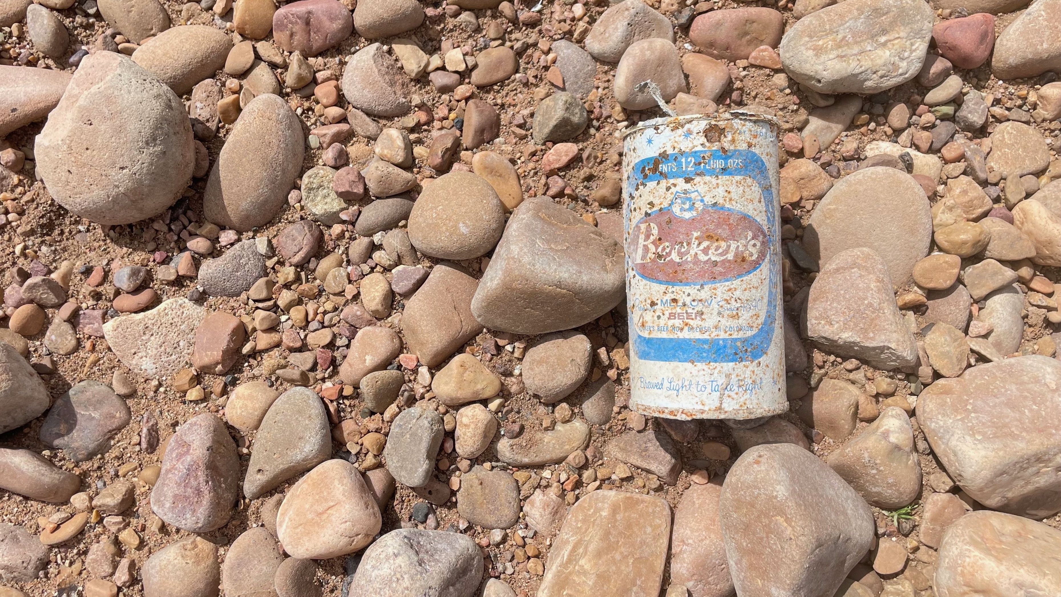 County emptying, plans to install a replacement section of pipeline across the bed of the lake are expected to move forward next week. An empty Becker's beer can is pictured on the drained lake bed on Sunday. Becker's was an Ogden company.