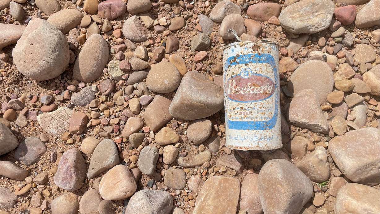 County emptying, plans to install a replacement section of pipeline across the bed of the lake are expected to move forward next week. An empty Becker's beer can is pictured on the drained lake bed on Sunday. Becker's was an Ogden company.