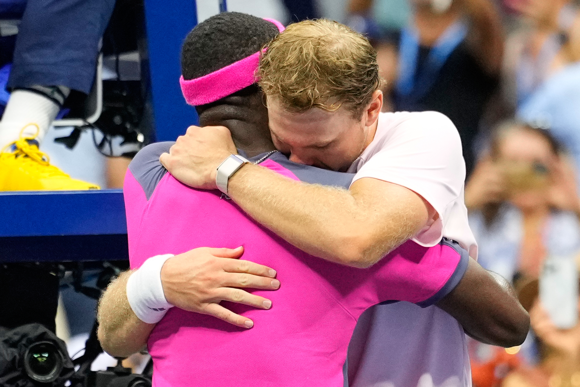 Frances Tiafoe, left, of the United States, and Alex Michelsen, of the United States, embrace after Tiafoe won their match in the quarterfinal round of the U.S. Open tennis championships, Tuesday, Sept. 8, 2026, in New York.  CORRECTION: Corrects Tiafoe to left, not right.