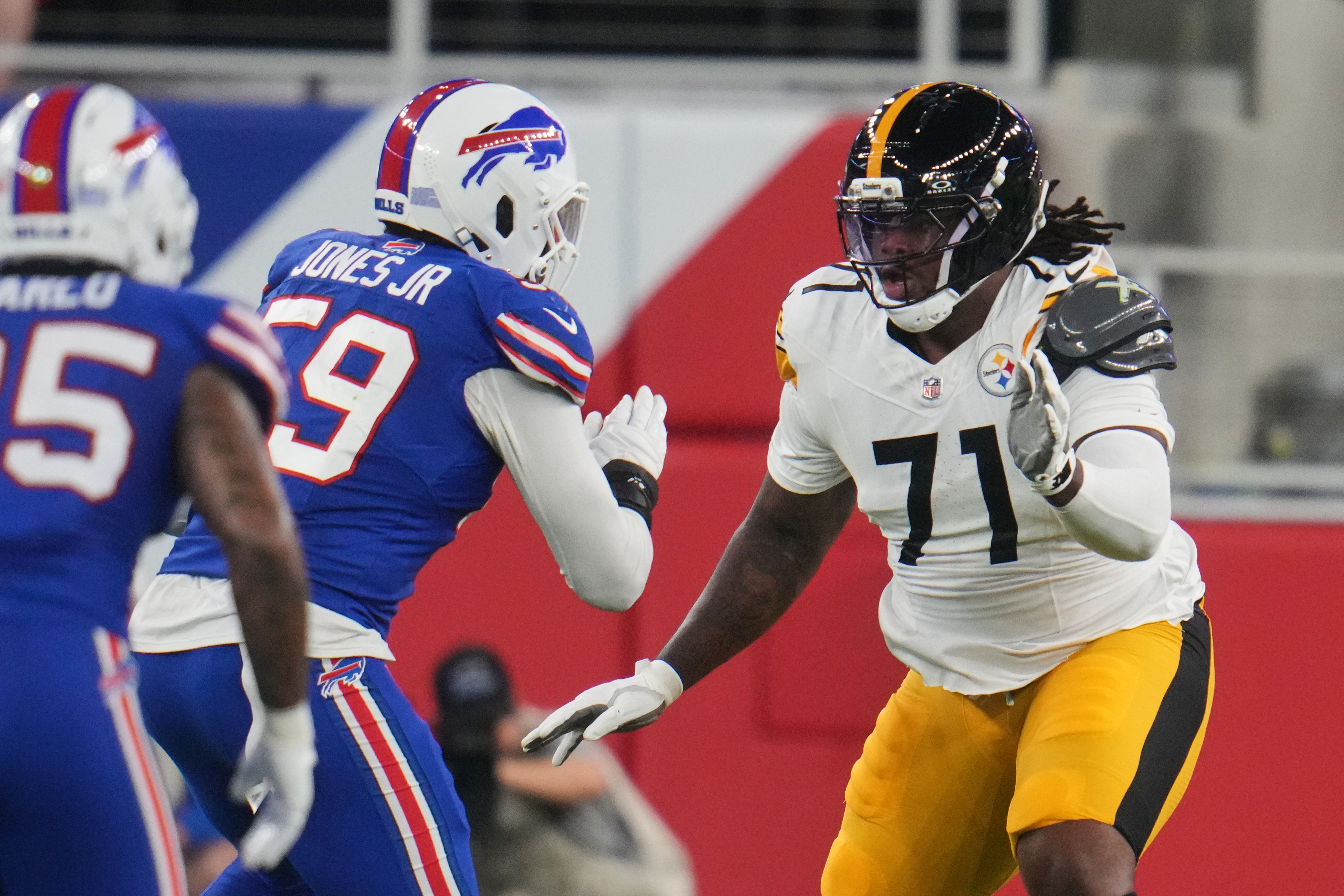 Pittsburgh Steelers offensive tackle Max Iheanachor (71) defends against the rush by Buffalo Bills' Andre Jones Jr. (59) in the first half of a preseason NFL football game in Orchard Park, NY., Thursday, Aug. 27, 2026. 