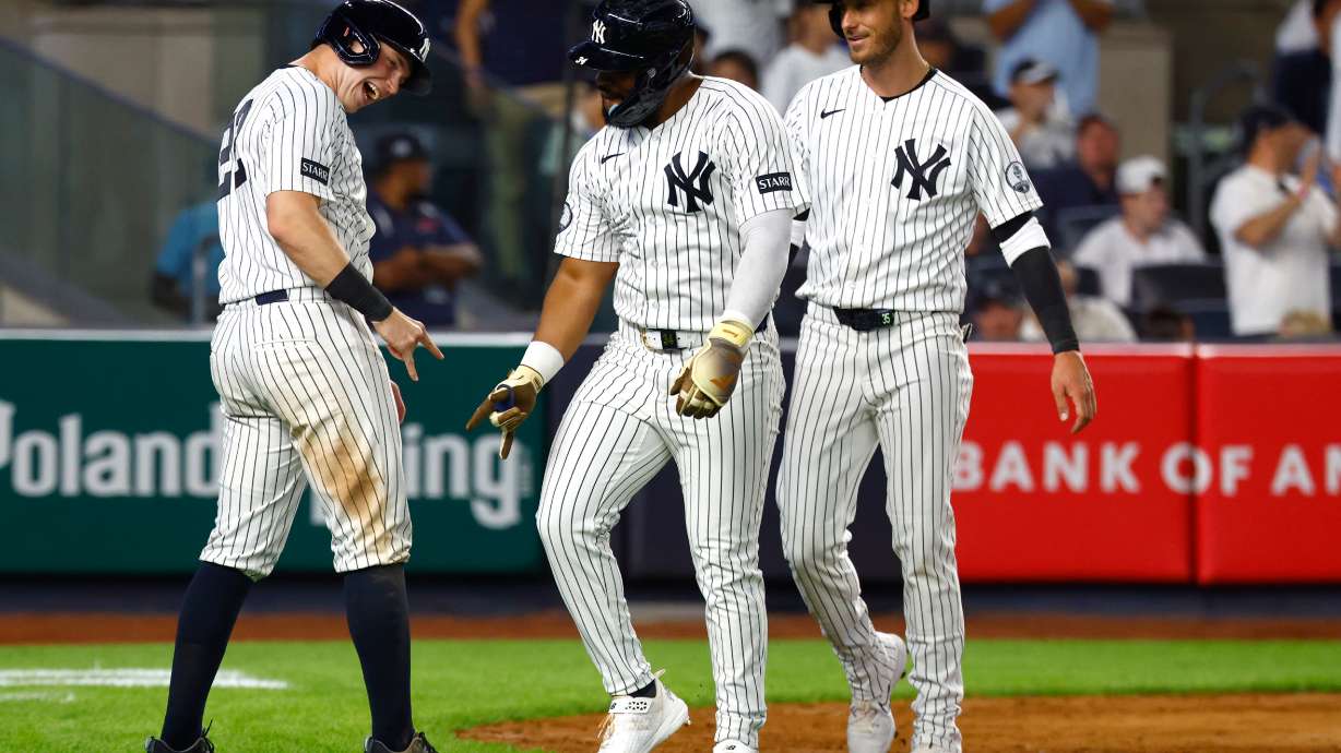 New York Yankees' Ben Rice, left and Heliot Ramos, right , celebrate after Ramos three-run home run during the eighth inning of a baseball game against theColorado Rockies , Tuesday, Sept. 8, 2026, in New York.