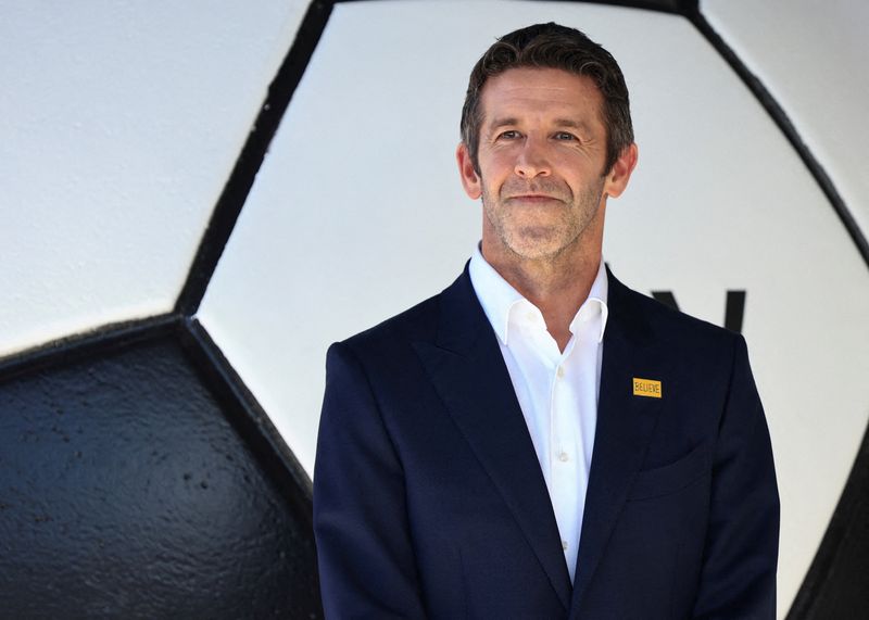 FILE PHOTO: Apple's Senior Vice President Hardware Engineering John Ternus attends the premiere of season four of the Apple TV series "Ted Lasso" at the Academy Museum in Los Angeles, California, U.S., July 27, 2026.