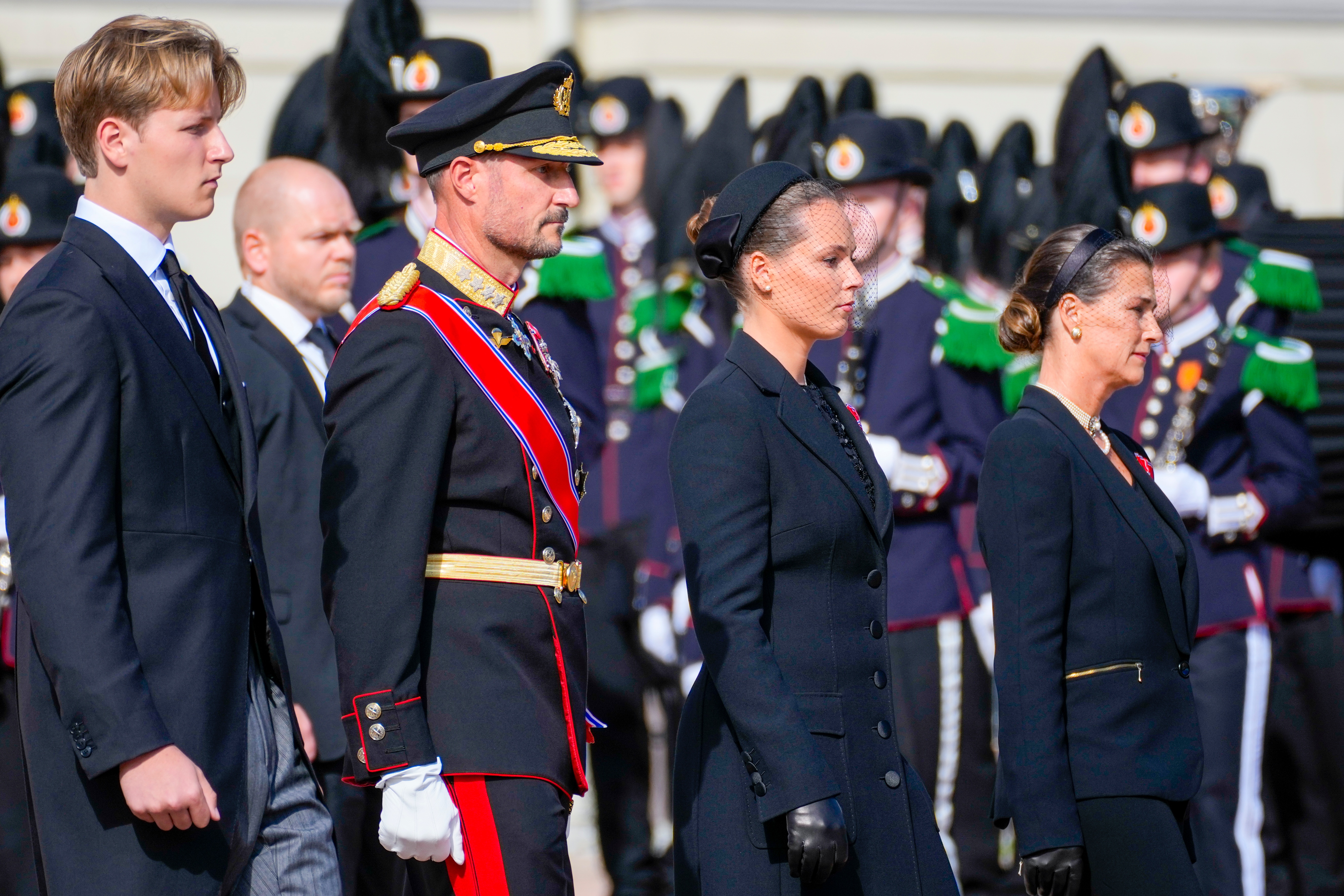 Members of Norway’s royal family, from left, Prince Sverre Magnus, King Haakon VIII, Crown Princess Ingrid Alexandra and Princess Märtha Louise walk behind the coffin of King Harald V as it is carried from the Royal Palace to Oslo Cathedral in Oslo, Norway on Wednesday.
