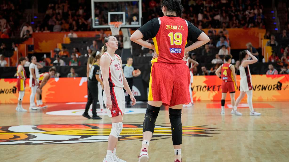 United States' Paige Bueckers talks to China's Zhang Ziyu during the Women's Basketball World Cup match between China and the United States in Berlin, Friday, Sept. 4, 2026.