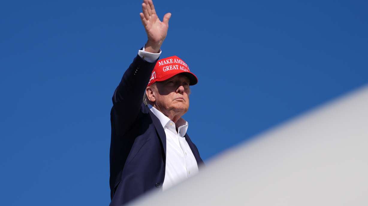 President Donald Trump boards Air Force One at Morristown Airport, Monday, in Morristown, N.J. The White House says the United States is banning dairy products, most alcoholic beverages and some motorcycles from Canada, starting Sept. 29, as their trade war escalates.